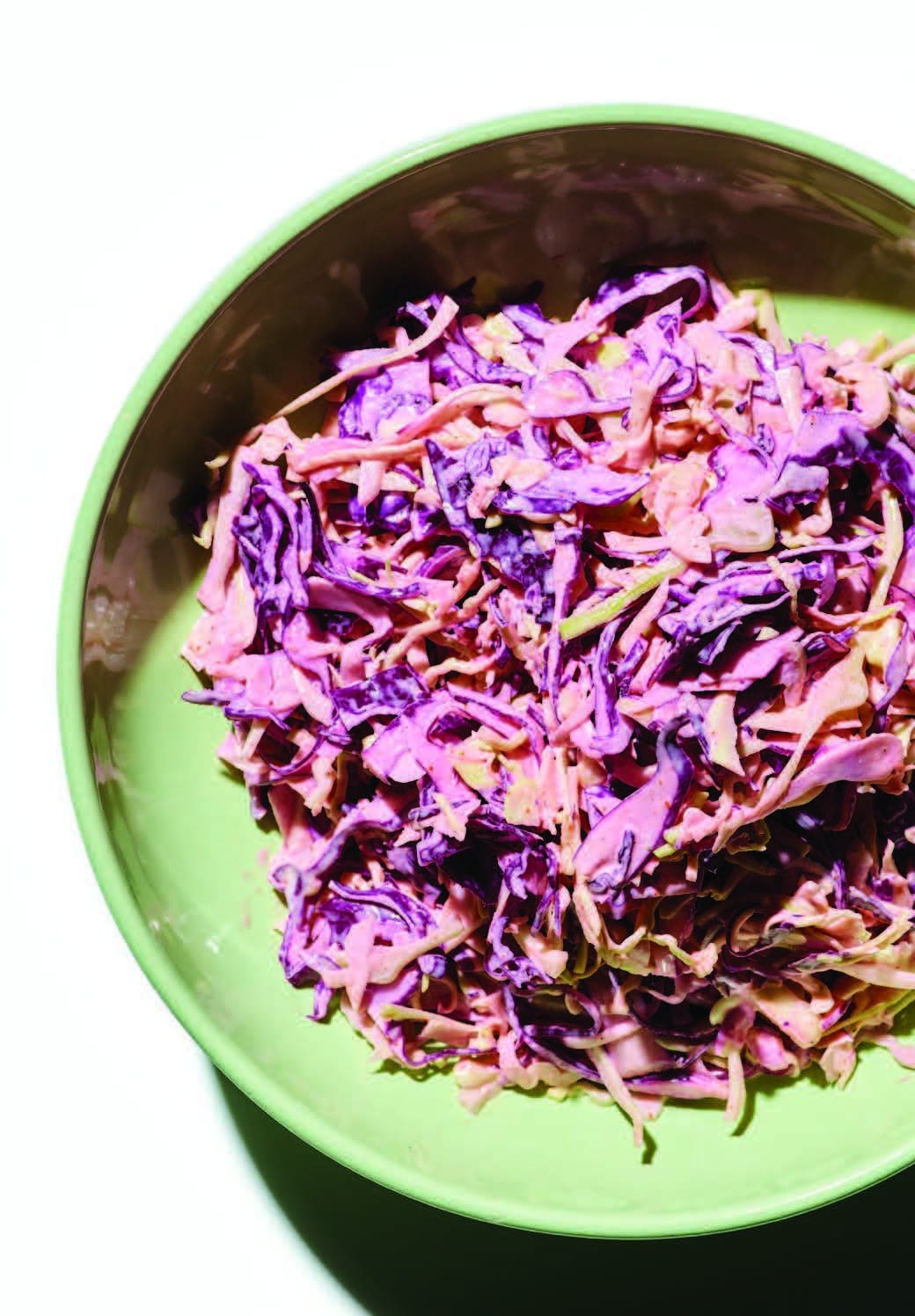 Bowl of red cabbage slaw with vinaigrette