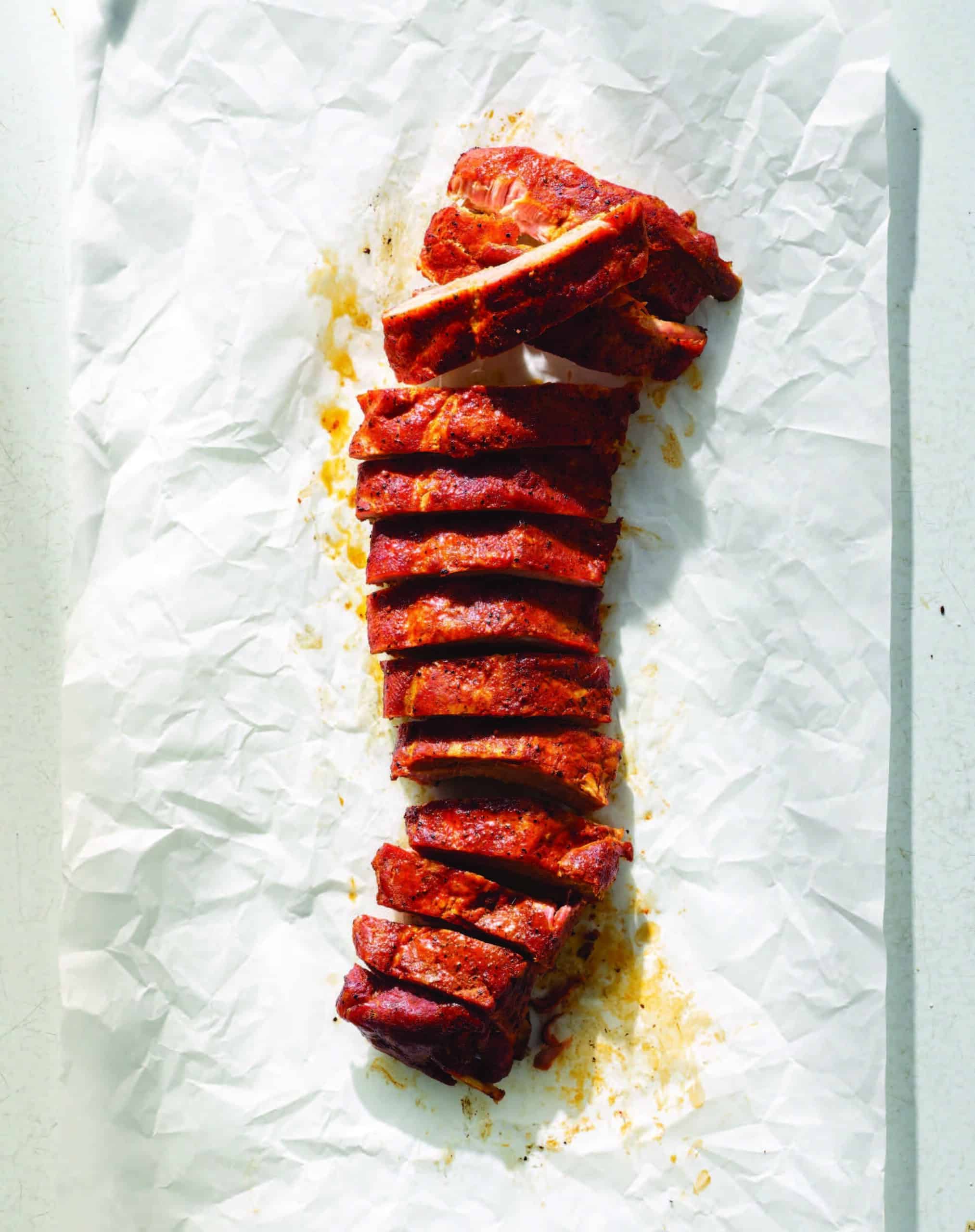 Championship St. Louis ribs with glaze and bark, sliced and ready to serve.