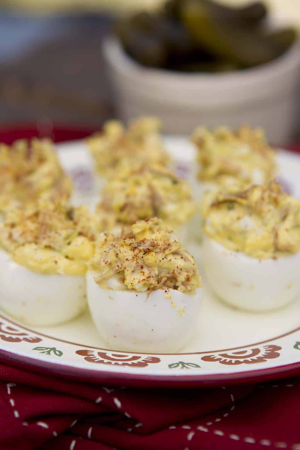 Deviled eggs topped with BBQ rub and chopped smoked meat