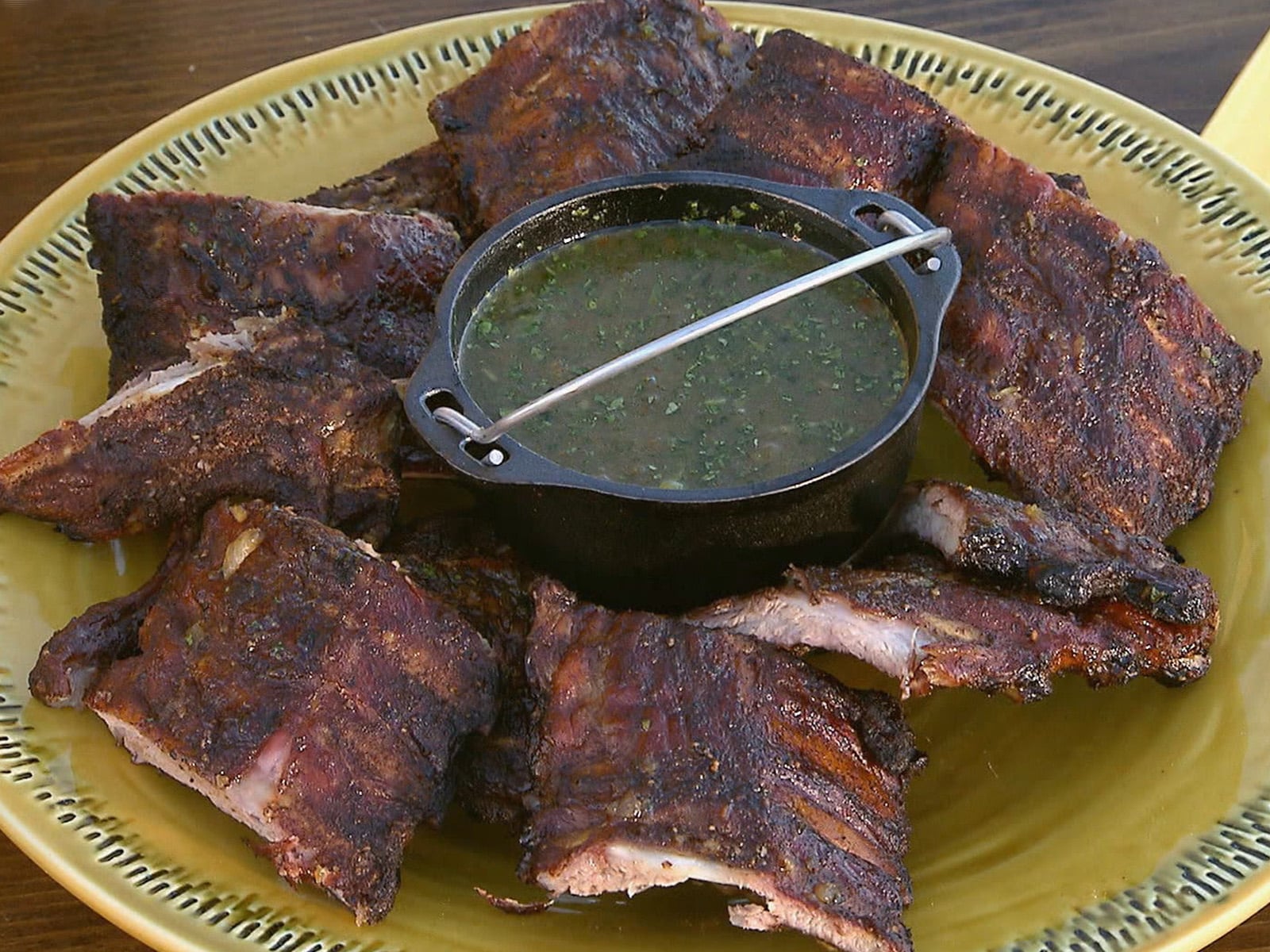 Glazed baby back ribs with a rich pineapple BBQ sauce, sliced and ready to serve.