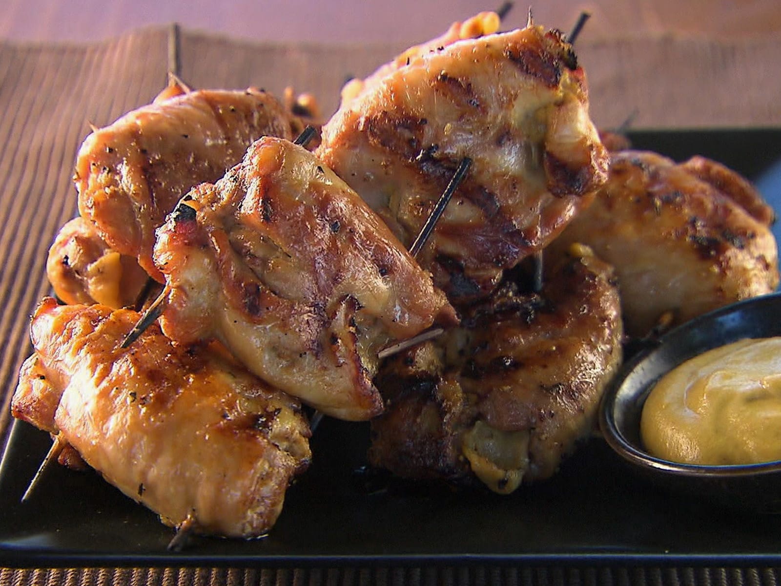 Grilled Serbian chicken bundles stuffed with ham, bacon, and cheese