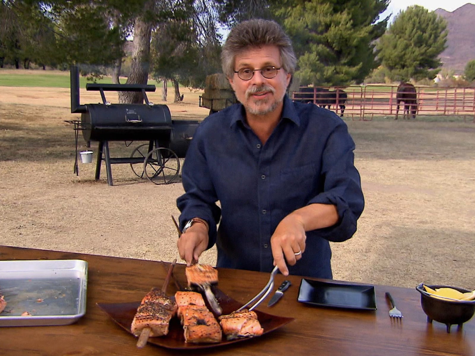 Tandoori grilled salmon steaks charred and golden, resting on a platter