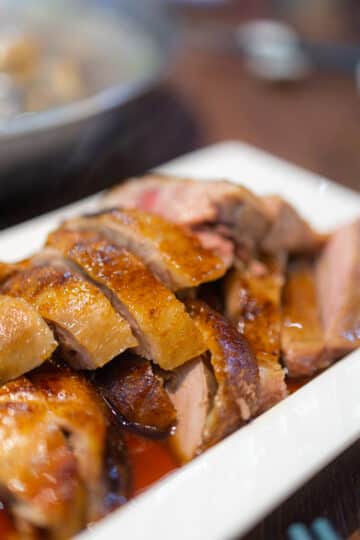 Sweet and sour duck with crispy skin and rosemary shallot glaze