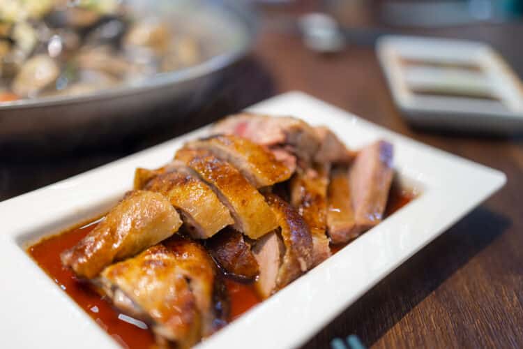 Sweet and sour duck with crispy skin and rosemary shallot glaze