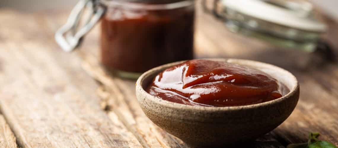 7-Up Barbecue Sauce in a bowl with a basting brush