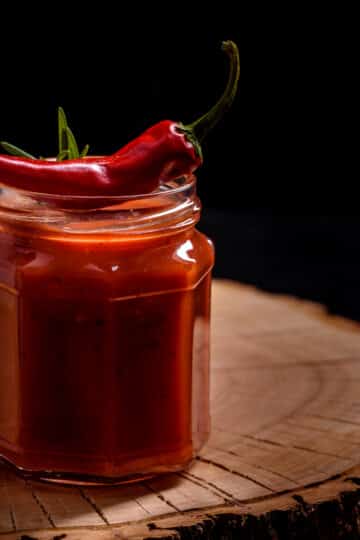 Bowl of country hot sauce made with fresh diced vegetables and herbs.