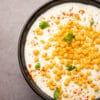 Cream sweet corn in a cast iron skillet with butter and pepper.
