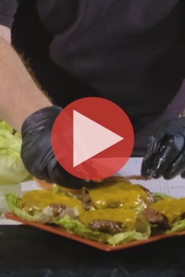 BBQ Pitmaster Myron Mixon plating keto bacon cheeseburgers fresh from the smoker