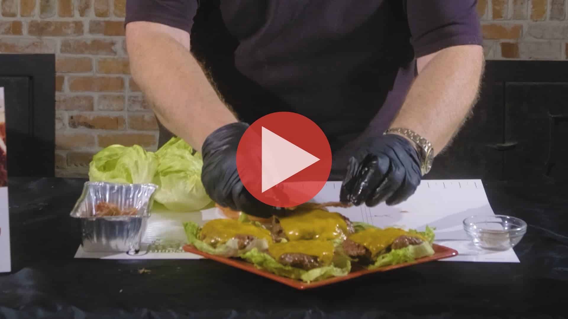 BBQ Pitmaster Myron Mixon plating keto bacon cheeseburgers fresh from the smoker
