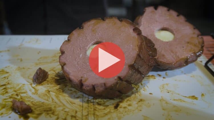 Myron Mixon preparing smoked bologna stuffed with pepper jack cheese on BBQ Pitmaster