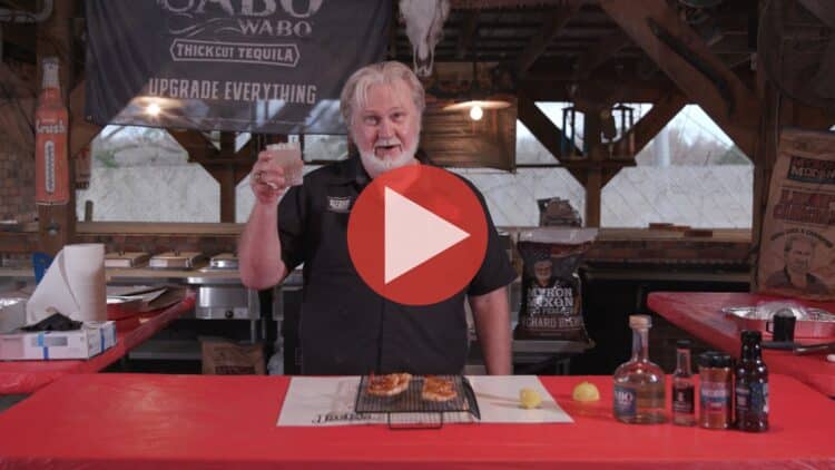 Grilled shrimp skewers on a rack with hot rub and blackberry sauce from BBQ Pitmaster