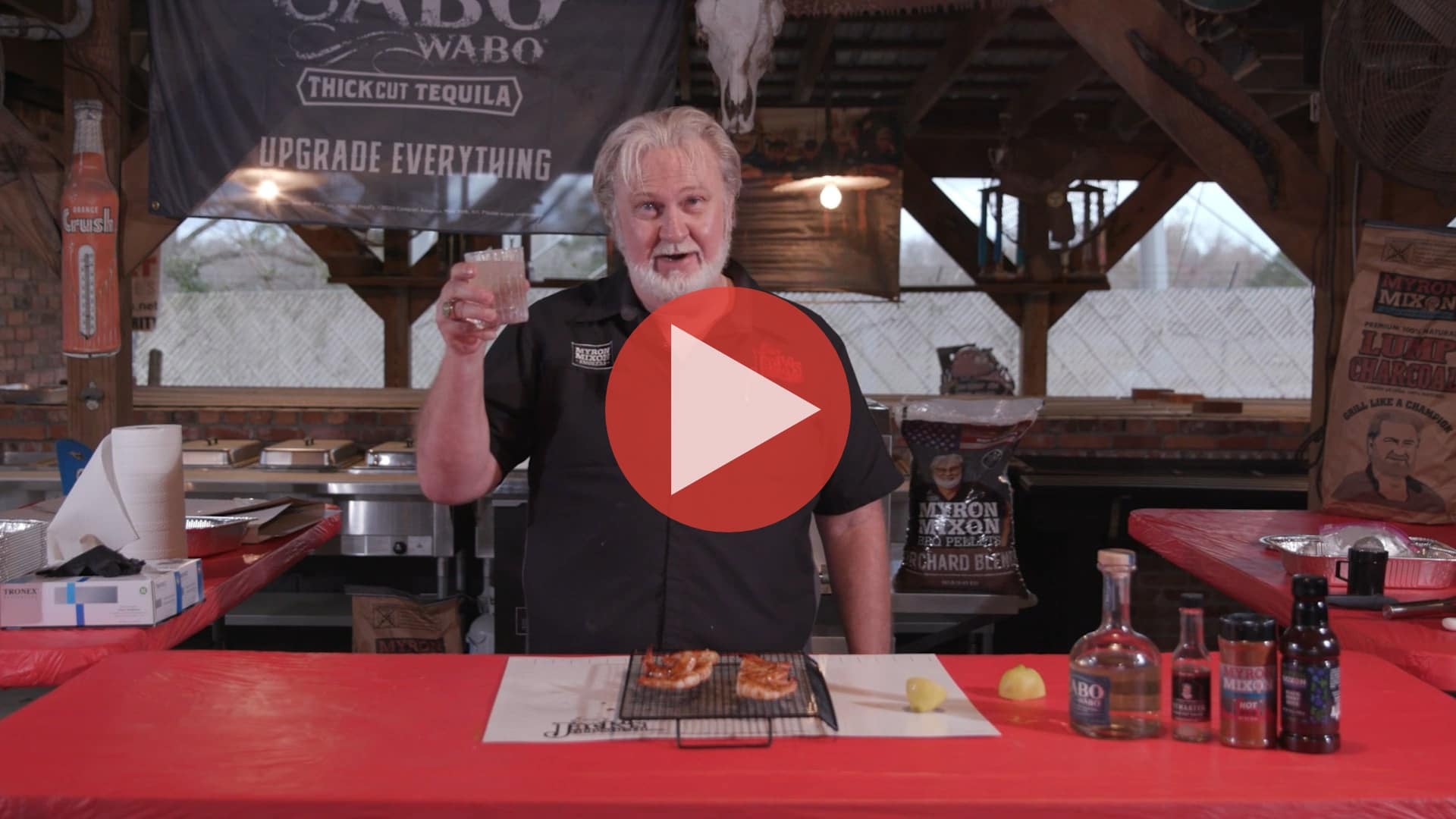 Grilled shrimp skewers on a rack with hot rub and blackberry sauce from BBQ Pitmaster