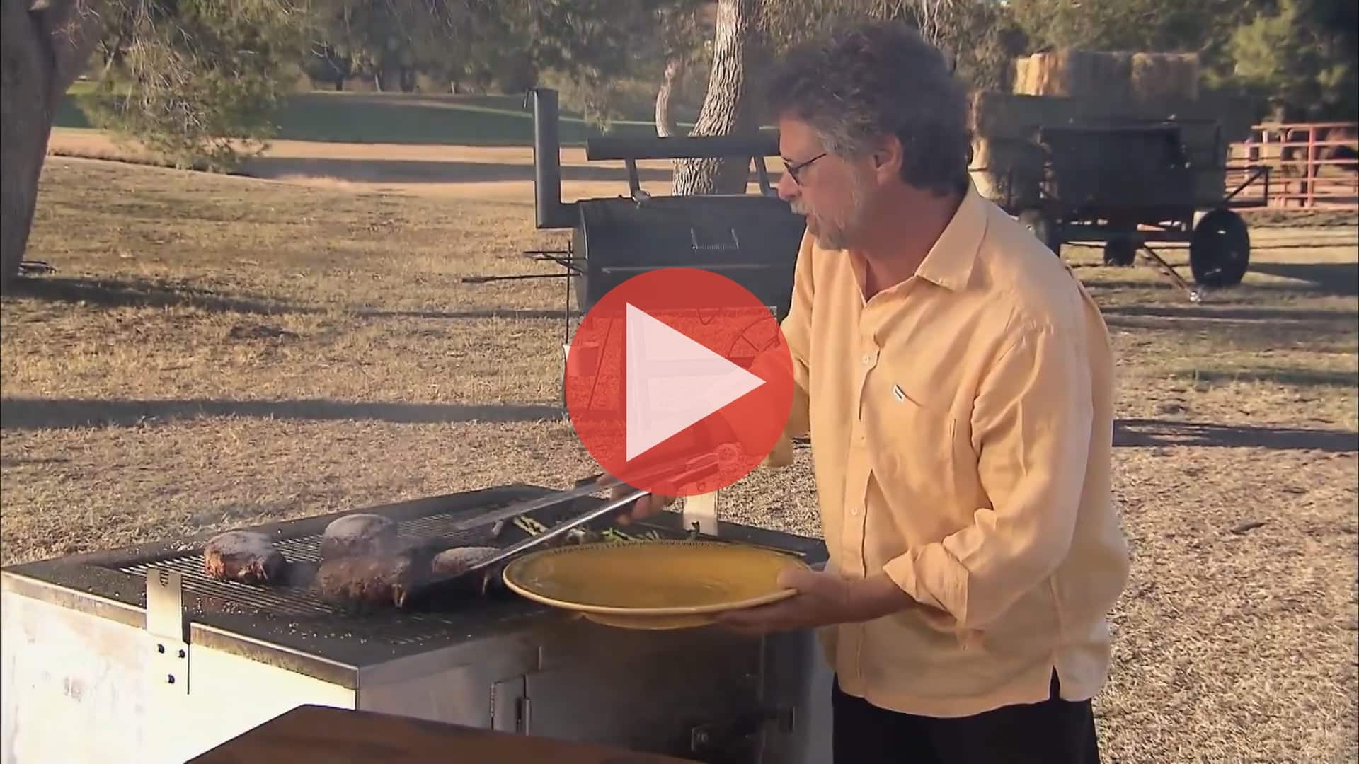 Steven Raichlen grilling shrimp and steaks in Spanish Smoke